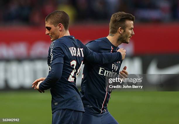 Marco Verratti of PSG is substituted by David Beckham during the french Ligue 1 match between Paris Saint-Germain FC and AS Nancy-Lorraine ASNL at...