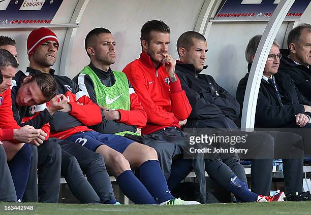 Alex, Jeremy Menez and David Beckham of PSG sit on the bench during the french Ligue 1 match between Paris Saint-Germain FC and AS Nancy-Lorraine...