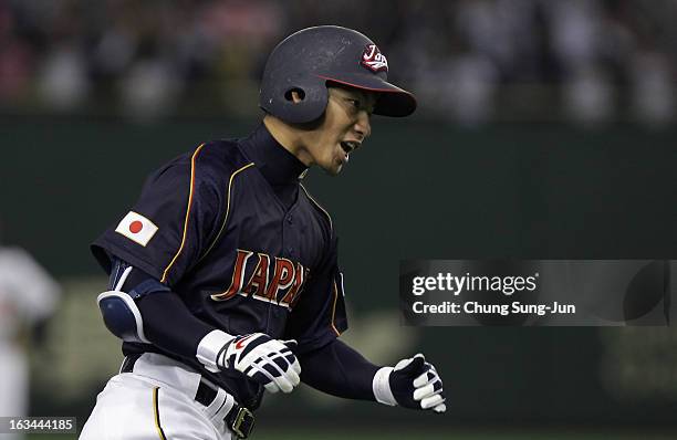 Infielder Takashi Toritani of Japan reacts after hits a solo home run top of the first inning during the World Baseball Classic Second Round Pool 1...