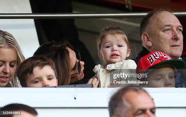 Victoria Beckham holds her daughter Harper Beckham during the french Ligue 1 match between Paris Saint-Germain FC and AS Nancy-Lorraine ASNL at the...