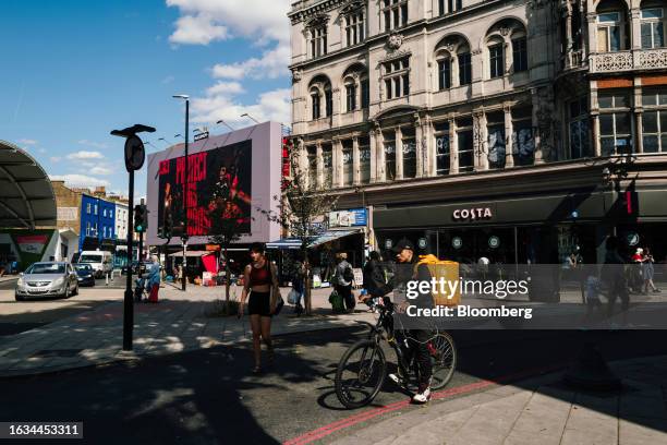 Food courier for Just East Takeaway.com makes deliveries during a hot day in the Peckham district of London, UK, on Tuesday, Aug. 22, 2023. Heat...
