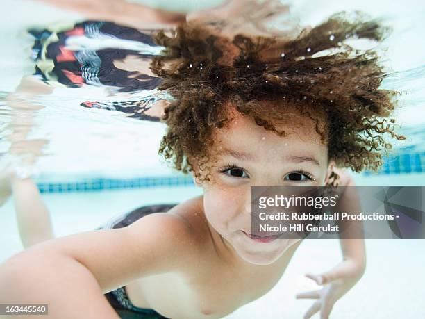 usa, utah, orem, boy (4-5) swimming in pool - boy swimming pool stock pictures, royalty-free photos & images