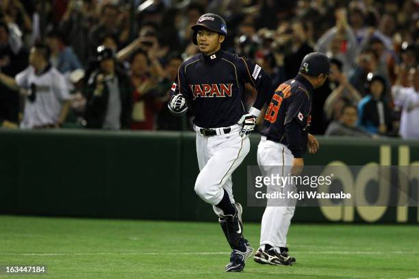 Infielder Takashi Toritani of Japan celerates after scoring hits a homer in the top half of the first inning during the World Baseball Classic Second...