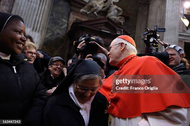 Brasilian cardinal and Sao Paulo archbishop Odilo Pedro Scherer waves to the faithful as he arrives at St. Andrea al Quirinale church to lead a...