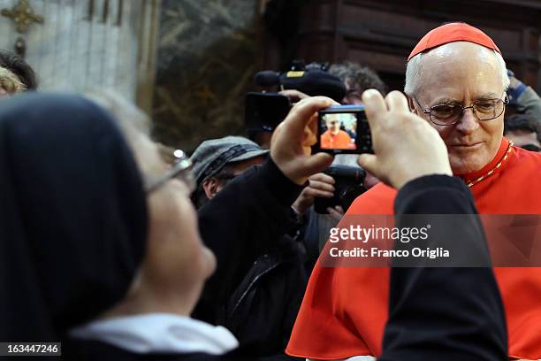 Catholic nun takes a picture of Brasilian cardinal and Sao Paulo archbishop Odilo Pedro Scherer arrives at St. Andrea al Quirinale church to lead a...