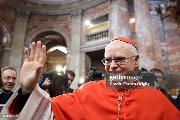 Brasilian cardinal and Sao Paulo archbishop Odilo Pedro Scherer waves to the faithful as he arrives at St. Andrea al Quirinale church to lead a...