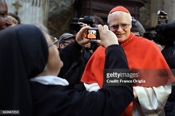 Catholic nun takes a picture of Brasilian cardinal and Sao Paulo archbishop Odilo Pedro Scherer arrives at St. Andrea al Quirinale church to lead a...