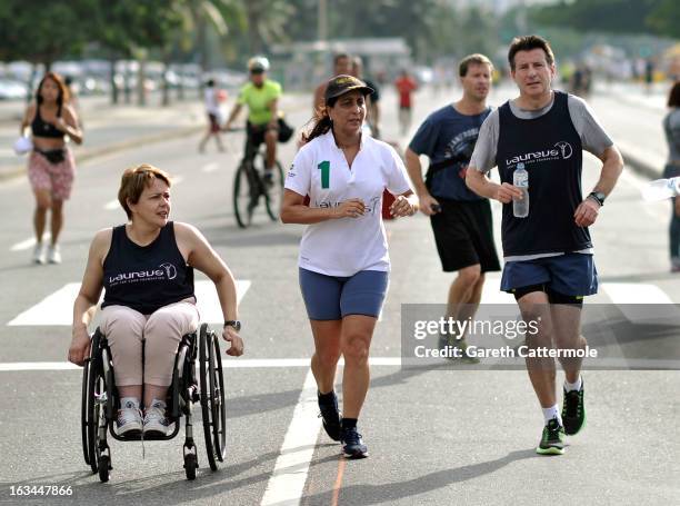 Laureus Academy Members Tanni Grey - Thompson,Nawal El Moutawakel and Lord Sebastian Coe in action during the Laureus Run Copacabana Beach on March...