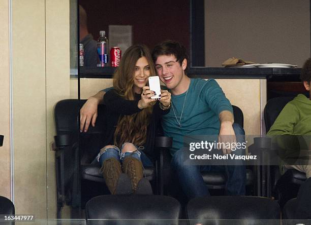 Sterling Beaumon and Sacha Edwards attend a hockey game between the Calgary Flames and Los Angeles Kings at Staples Center on March 9, 2013 in Los...