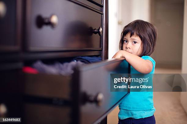 toddler looking in dresser drawer - chest of drawers stock pictures, royalty-free photos & images