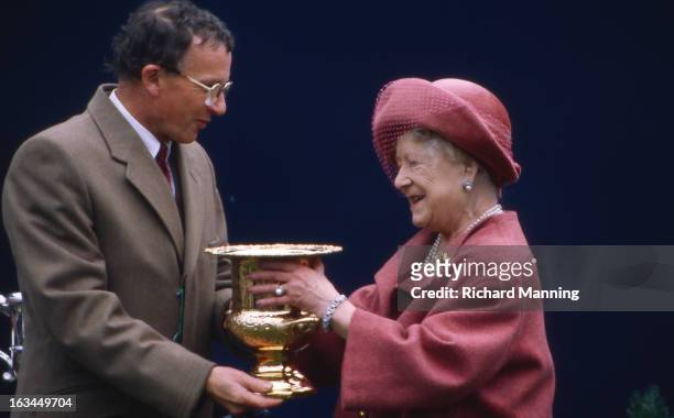 The Queen Mother receives the Grand Military Gold Cup, at the annually held Military meeting at Sandown Park Racecourse in Esher, Surrey. It is a...