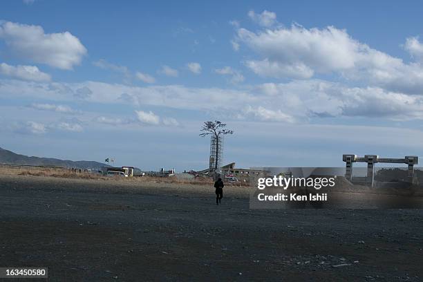 Vistor walks toward a replica of the pine tree prior to the second anniversary of the tsunami and earthquake on March 10, 2013 in Rikuzentakata,...