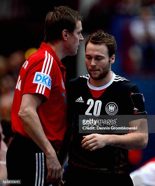 Head coach Martin Heuberger of Germany celebrates with Kevin Schmidt during the DHB International Friendly match between Germany and Switzerland at...
