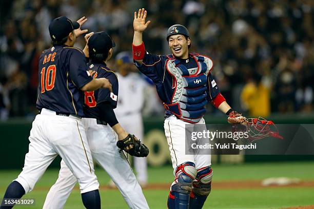 Ginjiro Sumitani and Shinnosuke Abe of Team Japan celebrate defeating Team Chinese Taipei in extra innings in Pool 1, Game 2 in the second round of...