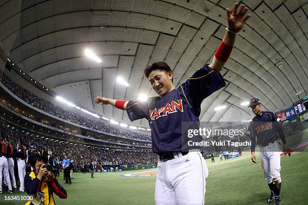 Seiichi Uchikawa of Team Japan celebrates defeating Team Chinese Taipei in extra innings in Pool 1, Game 2 in the second round of the 2013 World...