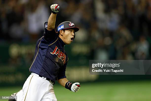 Hirokazu Ibata of Team Japan reacts to hitting a RBI single in the top of the ninth inning during Pool 1, Game 2 between Japan and Chinese Taipei in...