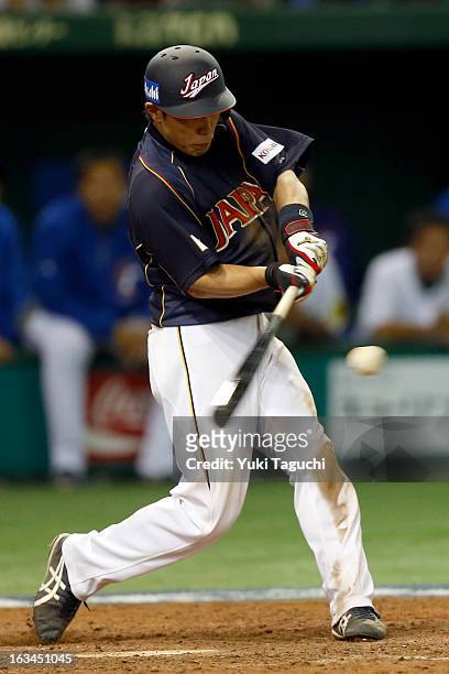 Hirokazu Ibata of Team Japan hits a RBI single in the top of the ninth inning during Pool 1, Game 2 between Japan and Chinese Taipei in the second...