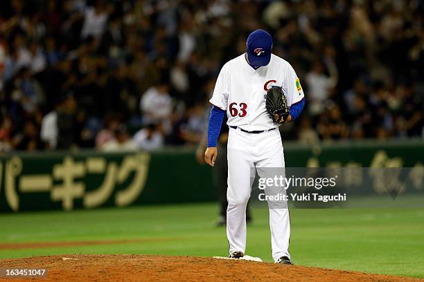 Yi-Hao Lin of Team Chinese Taipei reacts to giving up the go ahead run in the top of the 10th inning during Pool 1, Game 2 between Japan and Chinese...