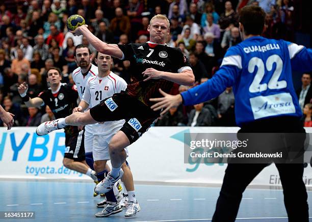 Patrick Wiencek of Germany goes for a goal during the DHB International Friendly match between Germany and Switzerland at Conlog-Arena on March 10,...