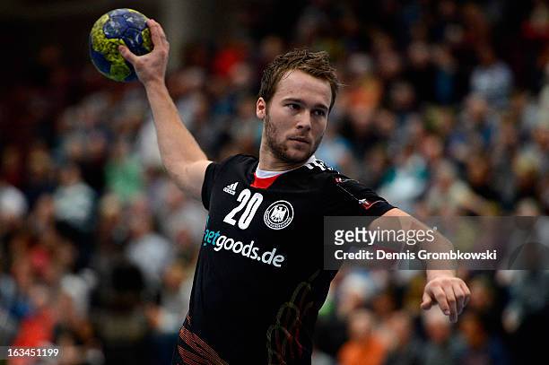 Kevin Schmidt of Germany throws the ball during the DHB International Friendly match between Germany and Switzerland at Conlog-Arena on March 10,...