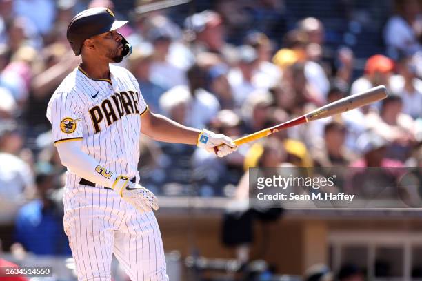 Xander Bogaerts of the San Diego Padres reacts after hitting a two run homerun during the sixth inning of a game against the Miami Marlins at PETCO...