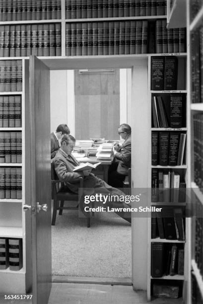 Along with unidentified others, American psychologist Dr Timothy Leary reads in his lawyer's office, Laredo, Texas, 1966. Leary was in Laredo to...