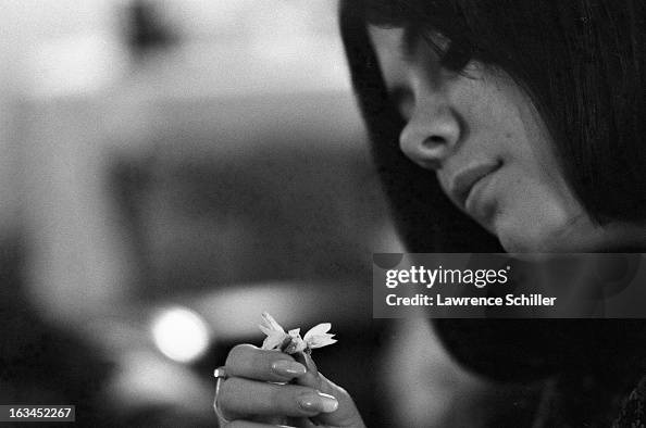 Lsd Addicts Close-up of a young woman, under the influence of LSD , examines a ...