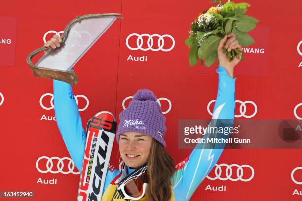 Race winner Tina Maze of Slovenia on the podium for the Audi FIS Alpine Skiing World Cup slalom race on March 10, 2013 in Ofterschwang, Germany,