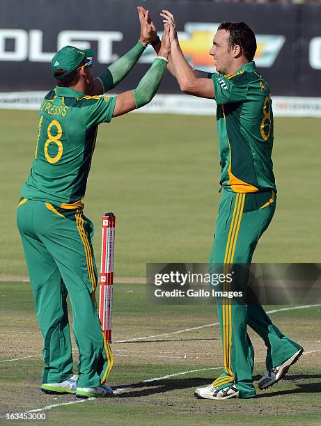 Kyle Abbott of South Africa celebrates the wicket of Younis Khan of Pakistan during the 1st One Day International match between South Africa and...