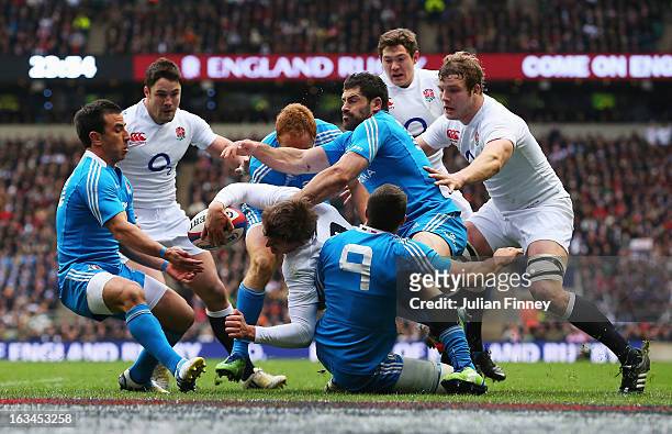 Toby Flood of England is tackled by the Edoardo Gori and Andrea Masi of Italy near the try line during the RBS Six Nations match England and Italy at...