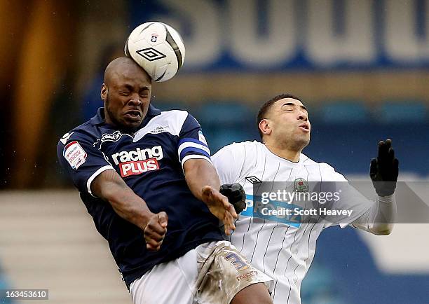 Danny Shittu of Millwall wins the header against Leon Best of Blackburn during the FA Cup Sixth round match between Millwall and Blackburn Rovers at...