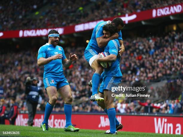 Luke McLean of Italy celebrates scoring their first try with Gonzalo Canale of Italy and Andrea Masi of Italy during the RBS Six Nations match...