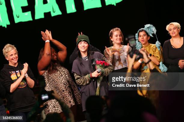 Billie Eilish and panelists pose onstage during Overheated, a one-off climate activism event presented by Support + Feed and Billie Eilish at...
