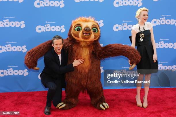 Actors Ryan Reynolds and Emma Stone attend "The Croods" premiere at AMC Loews Lincoln Square 13 theater on March 10, 2013 in New York City.