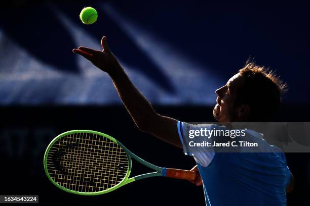 Richard Gasquet of France serves to Brandon Nakashima of the United States during their third round match of the Winston-Salem Open at Wake Forest...