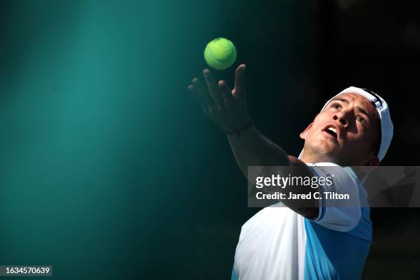 Sebastian Baez of Argentina serves to Aleksander Vukic of Australia during their third round match of the Winston-Salem Open at Wake Forest Tennis...