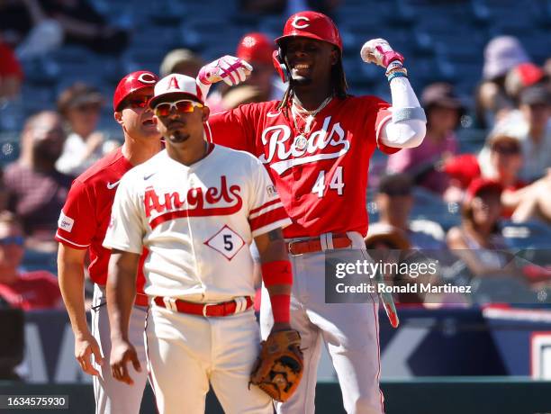 Elly De La Cruz of the Cincinnati Reds celebrates a three-run triple against the Los Angeles Angels in the seventh inning during game one of a...