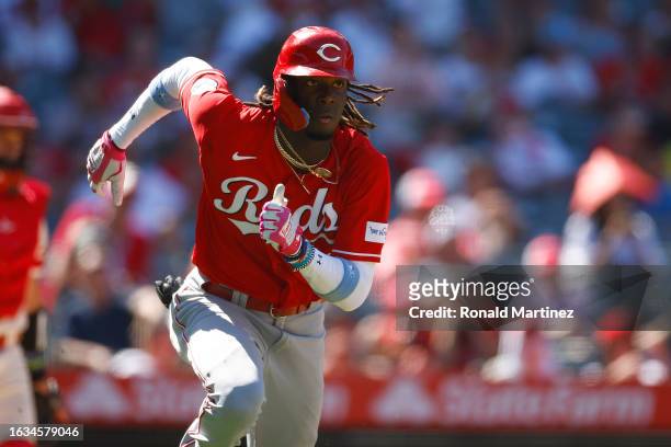 Elly De La Cruz of the Cincinnati Reds hits a three-run triple against the Los Angeles Angels in the seventh inning during game one of a doubleheader...