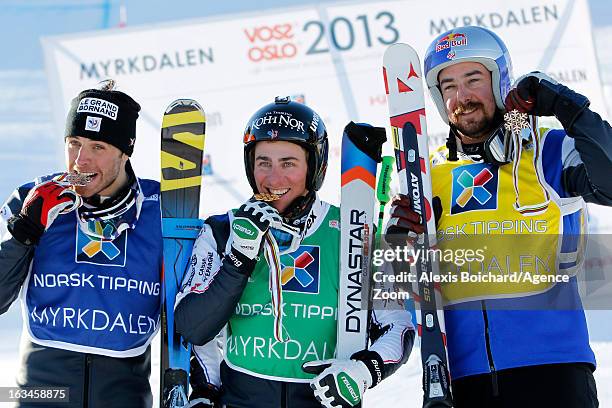 Jean-Frederic Chapuis of France takes 1st place,Bastien Midol of France takes 2nd place,John Teller of the USA takes 2nd place, during the FIS...