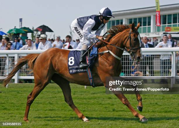 Jockey William Buick riding Gertrude Bell cantering to post for the Oaks at Epsom, 4th June 2010.