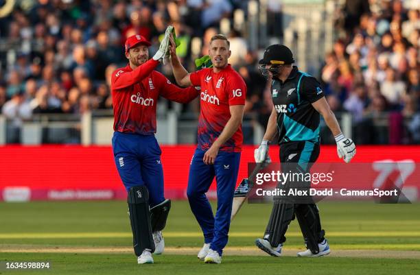 England's Luke Wood celebrates taking the wicket of New Zealand's Glenn Phillips during the 1st T20I match between England and New Zealand at Seat...