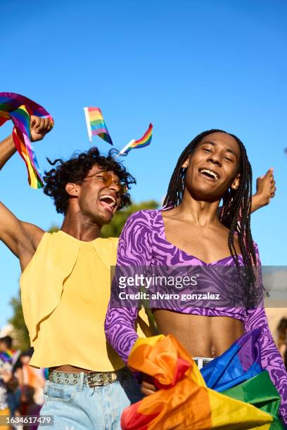 celebrating the pride day in the street - pride stock pictures, royalty-free photos & images