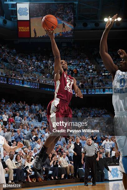 Michael Snaer of the Florida State Seminoles scores during a game against the North Carolina Tar Heels on March 03, 2013 at the Dean E. Smith Center...