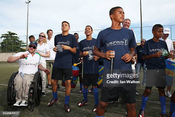 Local children perform at the Mercedes-Benz Sprinter handover to the Bola Project during 2013 Laureus World Sports Awards on March 10, 2013 in Rio de...