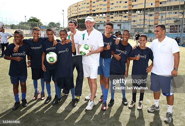 Laureus Ambassadors Michael Teuber and Axel Schulz attend the Mercedes-Benz Sprinter handover to the Bola Project during 2013 Laureus World Sports...