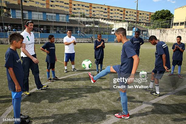 Local children play football at the Mercedes-Benz Sprinter handover to the Bola Project during 2013 Laureus World Sports Awards on March 10, 2013 in...