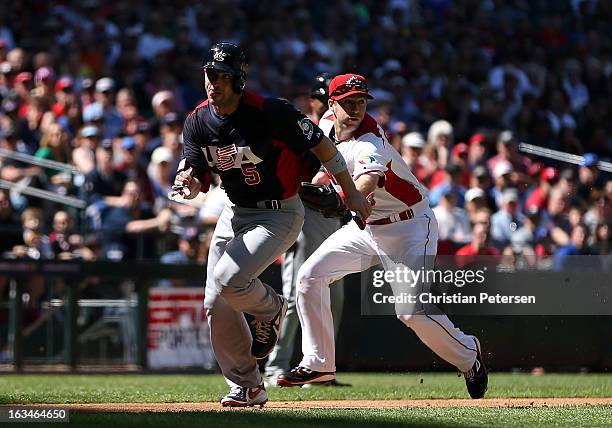 David Wright of USA is tagged out in a run down by infielder Taylor Green of Canada during the second inning of the World Baseball Classic First...