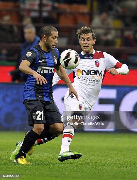 Walter Gargano of FC Inter Milan and Alessandro Diamanti of Bologna FC compete for the ball during the Serie A match between FC Internazionale Milano...