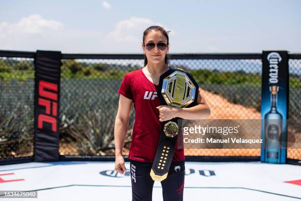 Alexa Grasso poses for a photo with her champion belt during the Noche UFC La Rojena Media Event at La Rojena on August 23, 2023 in Tequila, Mexico.