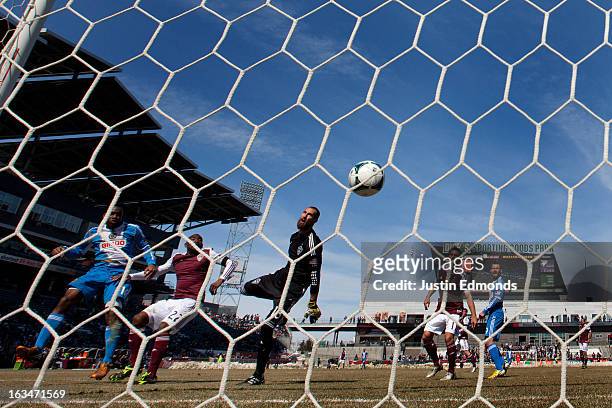 Amobi Okugo of the Philadelphia Union heads the ball in for a goal past Marvell Wynne and goalkeeper Matt Pickens of the Colorado Rapids during the...